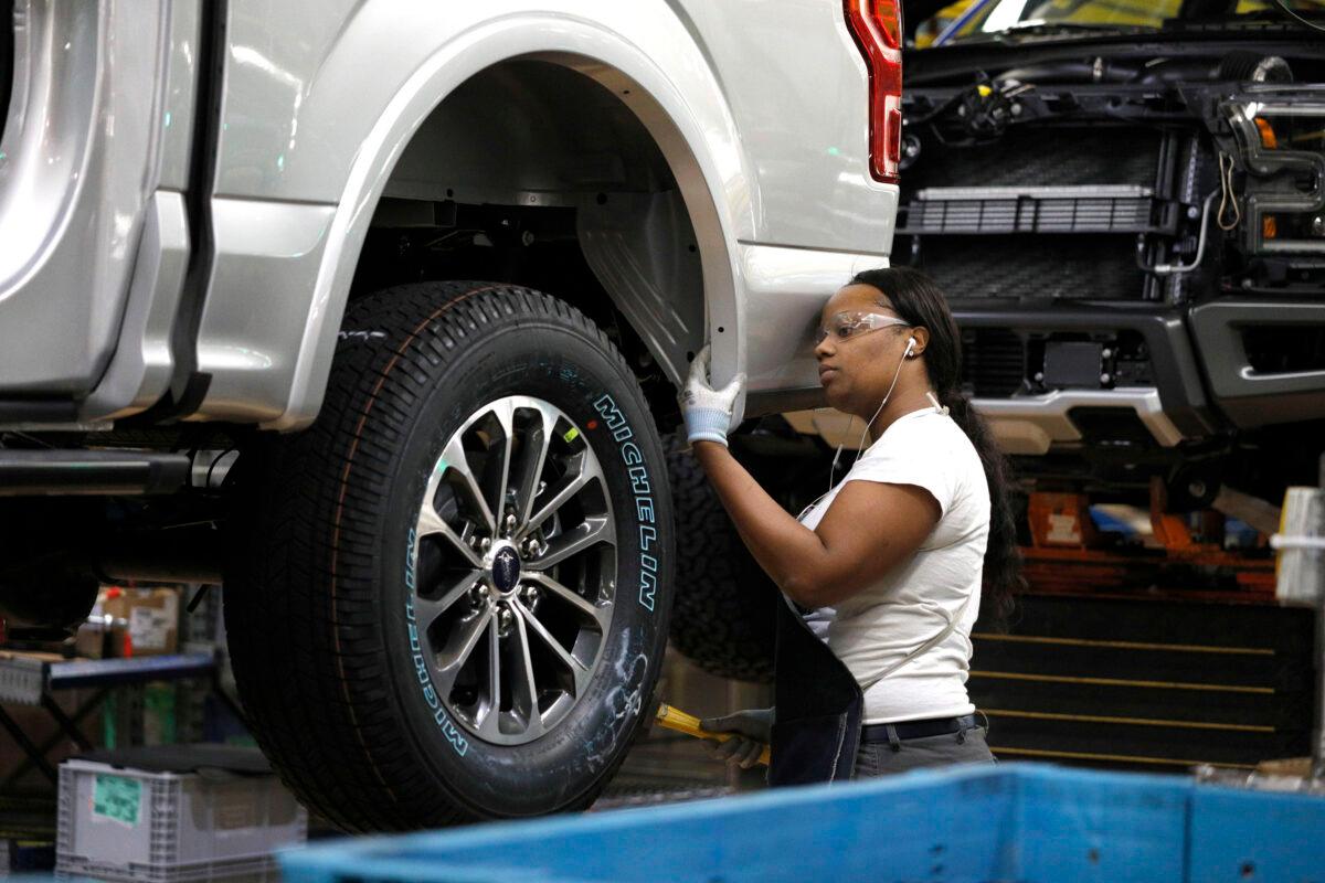 A Ford Motor Company worker works on a Ford F150 truck on the assembly line at the Ford Dearborn Truck Plant in Dearborn, Michigan, on Sept. 27, 2018. (Bill Pugliano/Getty Images)