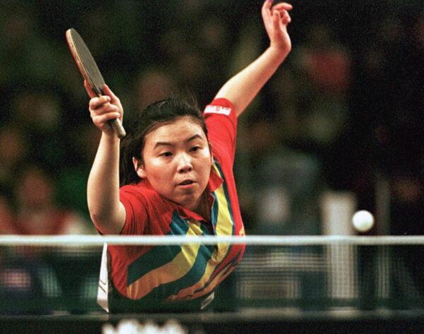 China's Den Yaping in action against South Korean Kim Hyon Hui during the women's team event at the World Table Tennis Championships in Manchester on 29 April, 1997. (Bob Collier/AFP via Getty Images)