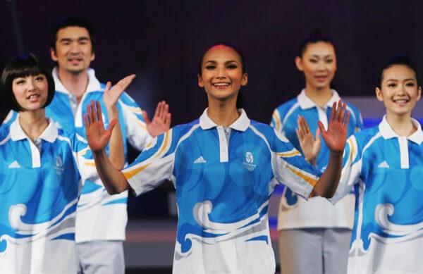 Chinese models display the uniforms for the volunteers of the 2008 Beijing Olympics and Paralympic Games in Beijing on Jan. 20, 2008. (Feng Li/Getty Images)