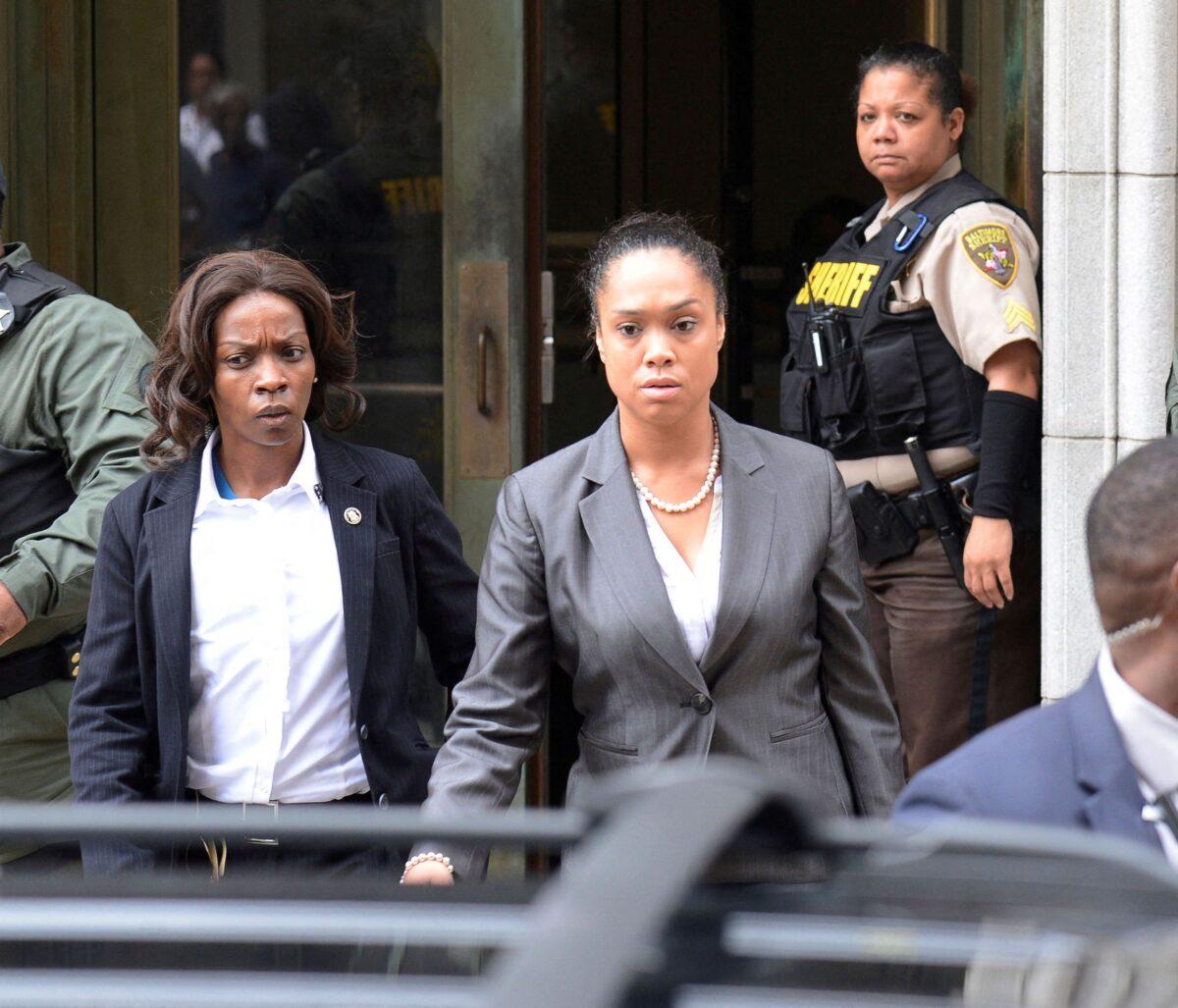 City state's attorney Marilyn Mosby (C) departs the courthouse in Baltimore on June 23, 2016. (Bryan Woolston/Reuters)