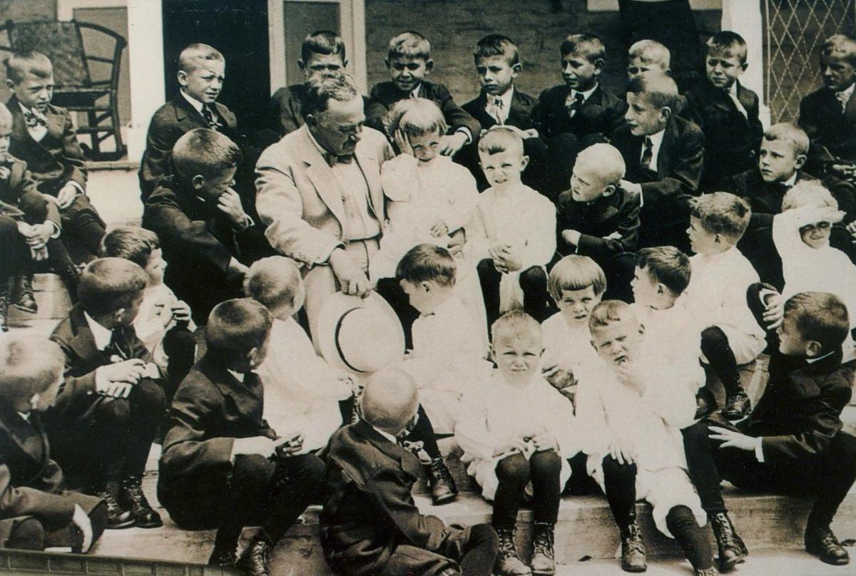  Milton Hershey with children. (Courtesy of Milton Hershey School)