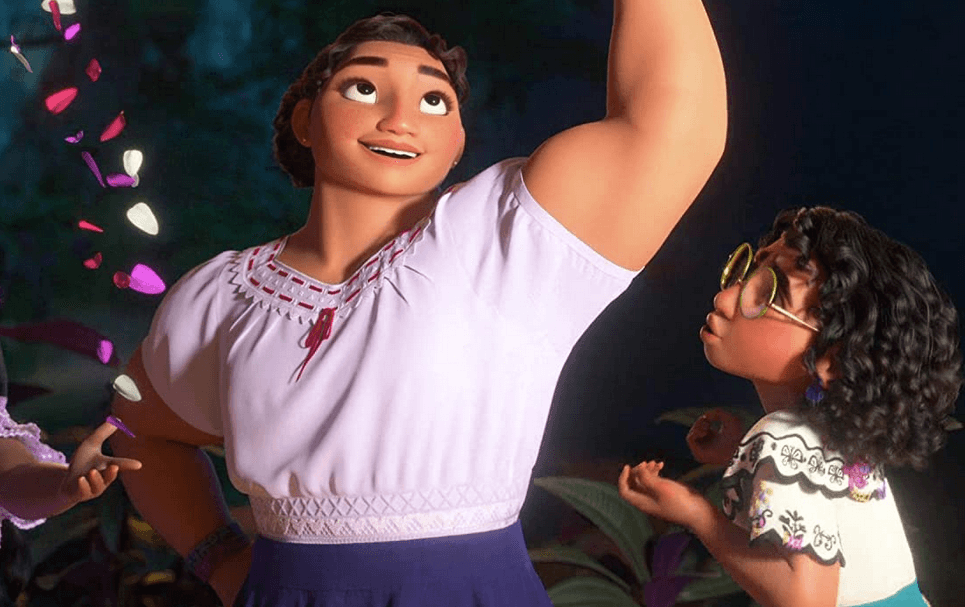 Big sister Luisa Madrigal (voiced by Jessica Darrow) sings a song while little sister Mirabel marvels at her magical muscles, in "Encanto." (Walt Disney Animation Studios)