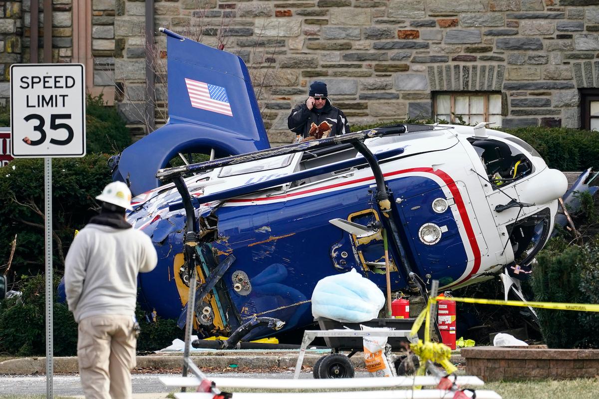 A medical helicopter rests next to the Drexel Hill United Methodist Church after it crashed the day before in the Drexel Hill section of Upper Darby, Pa, Wednesday, Jan. 12, 2022. (Matt Rourke/AP Photo)