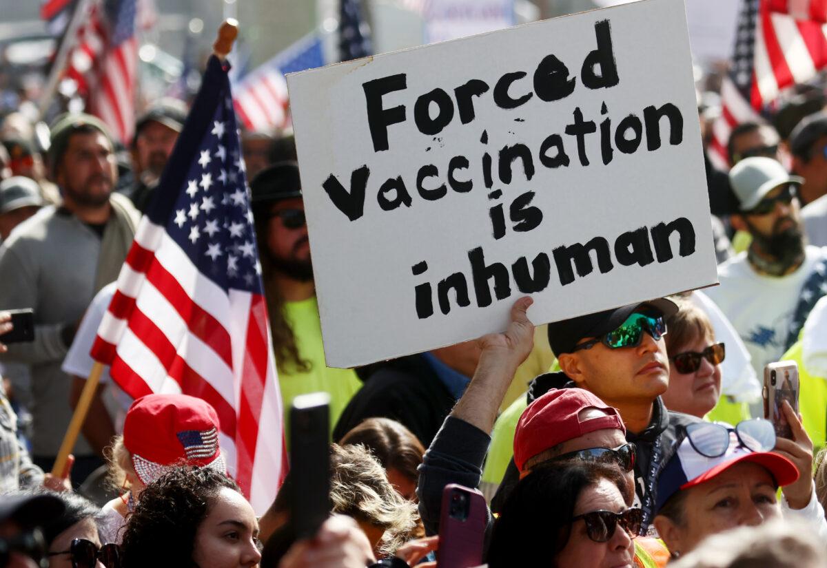 Protesters gather in Grand Park outside Los Angeles City Hall, at a March for Freedom rally, demonstrating against the Los Angeles City Council’s COVID-19 vaccine mandate for city employees and contractors, on Nov. 8, 2021. (Mario Tama/Getty Images)