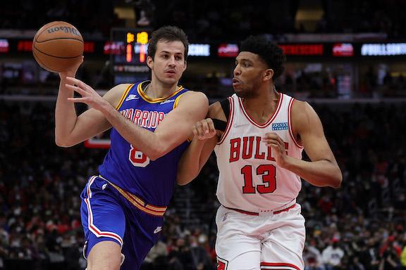 Nemanja Bjelica #8 of the Golden State Warriors is defended by Tony Bradley #13 of the Chicago Bulls during the second half of a game at United Center in Chicago on Jan. 14, 2022. (Stacy Revere/Getty Images)