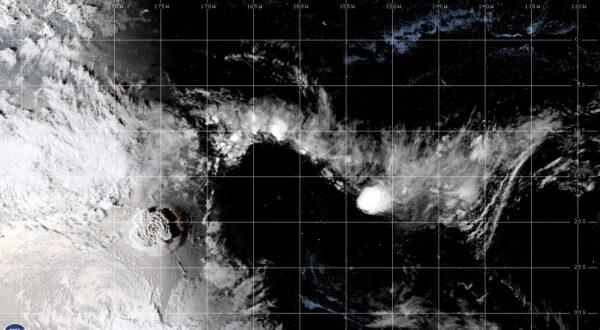 A white plume rises over Tonga when the underwater volcano Hunga Tonga-Hunga Ha'apai erupted, in this still image obtained from an animated GIF from the Cooperative Institute for Research in the Atmosphere (CIRA) and NOAA, on Jan. 15, 2021. (CIRA/NOAA/Handout via Reuters)