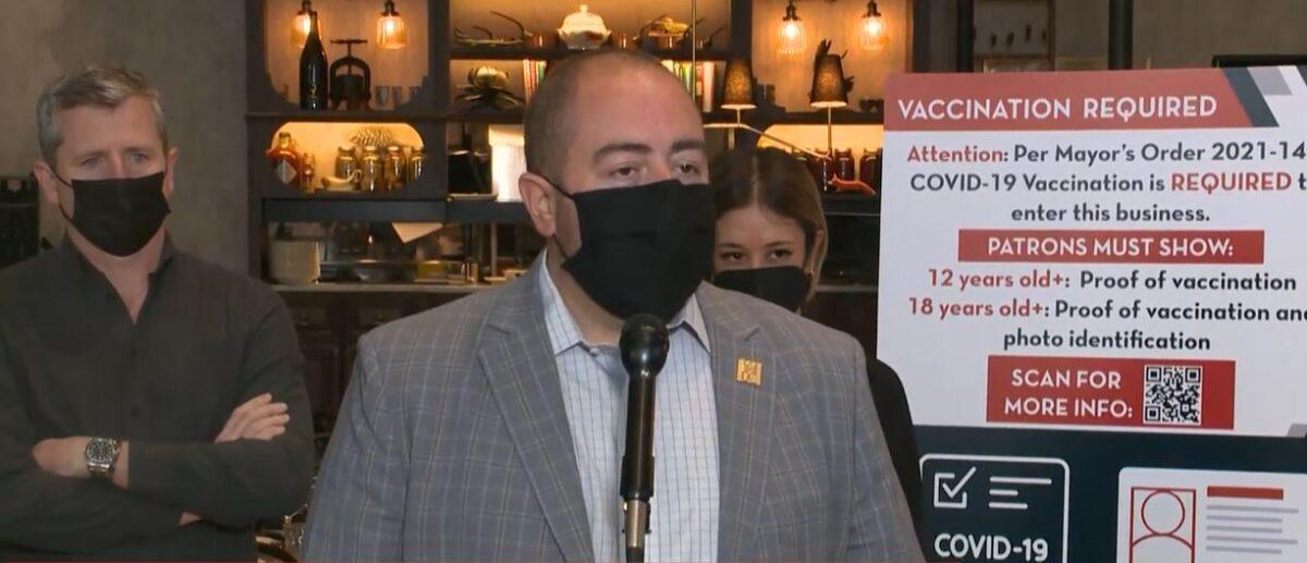 In this image from video, John Falcicchio, Washington's deputy mayor for planning and economic development, holds a press conference at Dauphine's restaurant on Jan. 14, 2022. (The Epoch Times via DC Mayor's Office)