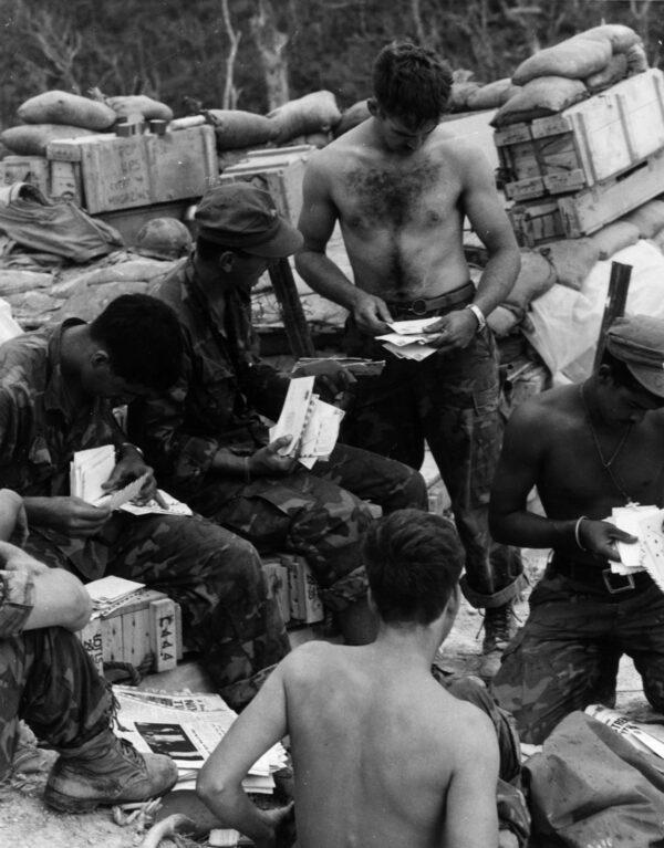 Soldiers of the 2nd Battalion, 4th Marine Regiment, at Fire Support Base Russell, Vietnam, in 1969. Letter reading and writing not only provided the men with a break but also provided history a firsthand account of events of the time. (Hulton Archive/Getty Images)