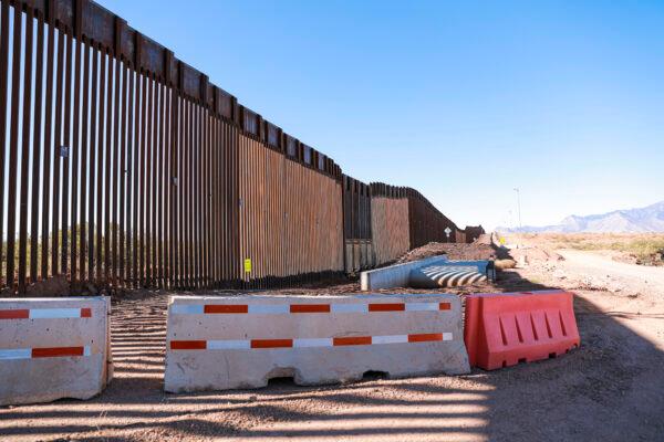 Exposed culverts for a flood bridge sit unfinished since January 2021, when President Joe Biden halted all border wall construction, in Cochise County, Ariz., on Dec. 6, 2021. (Charlotte Cuthbertson/The Epoch Times)