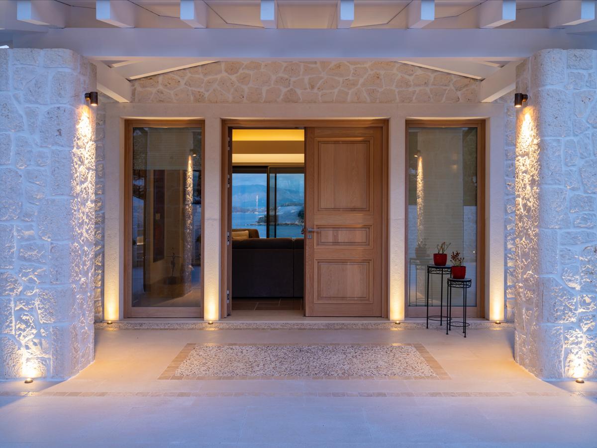 The hand-cut, triple-thick stone entrance of the main residence hints at the sumptuous rooms within. The estate was designed with comfort, optimal security, and entertaining as focal points. (Courtesy of Sotheby's International Realty - Greece)