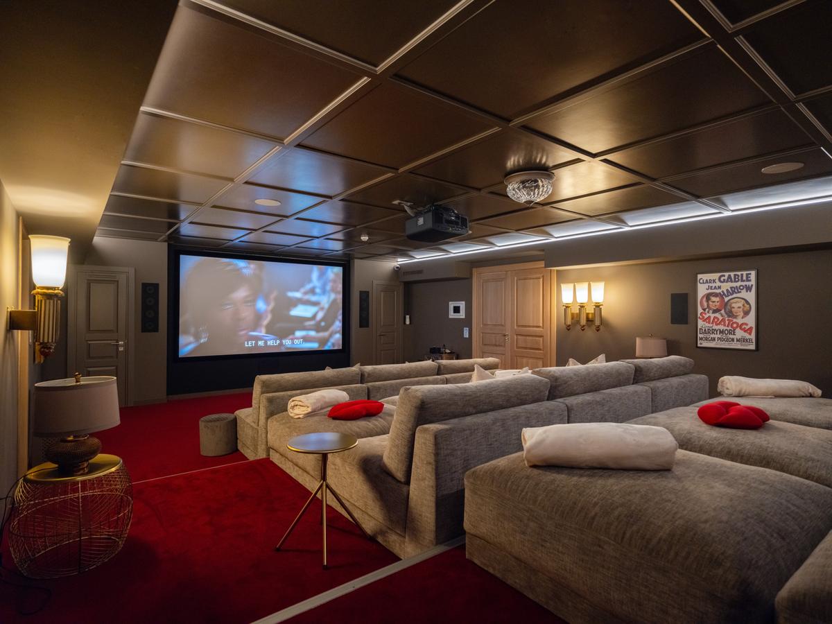 The media room is large enough to seat 15, and it features state-of-the-art projection, a massive viewing screen, and full Dolby Atmos sound. (Courtesy of Sotheby's International Realty - Greece)