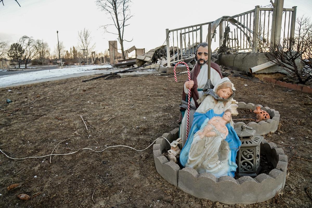 An electric nativity scene was the only thing left untouched by the Marshall Fire that destroyed an entire subdivision in Louisville, Colo., on Dec. 30, 2021. (Allan Stein/The Epoch Times)
