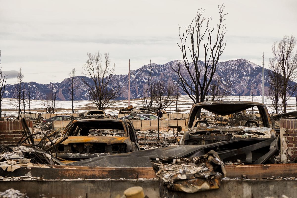 Numerous parked cars and trucks were gutted in the intense heat of the Marshall fire in Louisville, Colo., and Superior, Colo., on Dec. 30, 2021. (Allan Stein/The Epoch Times)