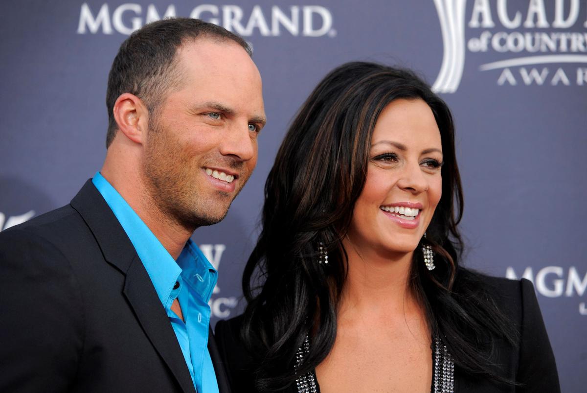 Former Alabama quarterback Jay Barker (L), and his wife country music singer Sara Evans arrive at the 46th annual Academy of Country Music Awards in Las Vegas on April 3, 2011. (Chris Pizzello/AP Photo)