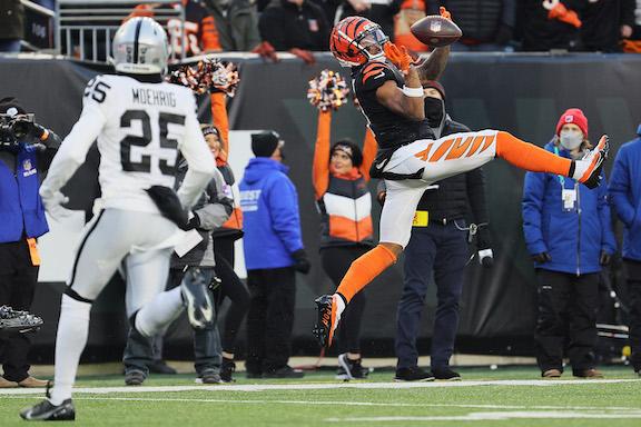 Wide receiver Ja'Marr Chase #1 of the Cincinnati Bengals makes a catch in front of free safety Trevon Moehrig #25 of the Las Vegas Raiders the first half of the AFC Wild Card playoff game at Paul Brown Stadium, in Cincinnati, on Jan. 15, 2022. (Andy Lyons/Getty Images)