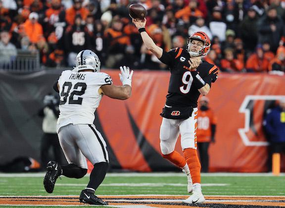 Quarterback Joe Burrow #9 of the Cincinnati Bengals throws pass in front of defensive end Solomon Thomas #92 of the Las Vegas Raiders in the second quarter of the AFC Wild Card playoff game at Paul Brown Stadium, in Cincinnati, on Jan. 15, 2022. (Andy Lyons/Getty Images)