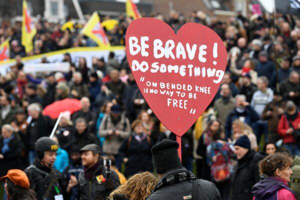 Demonstrators take part in a protest against the Dutch government's COVID-19 restrictions, in Amsterdam, Netherlands, on Jan. 16, 2022. (Piroschka van de Wouw/Reuters)