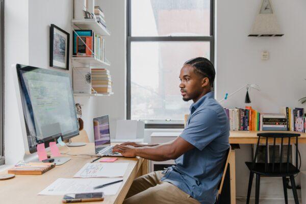 Stock photo of a man working at his desktop. (RODNAE Productions/Pexels)