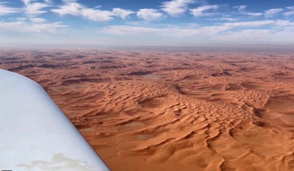 In this undated photo provided by FlyZolo, Zara Rutherford flies over the Saudi Arabian desert in her Shark ultralight plane. (FlyZolo via AP)