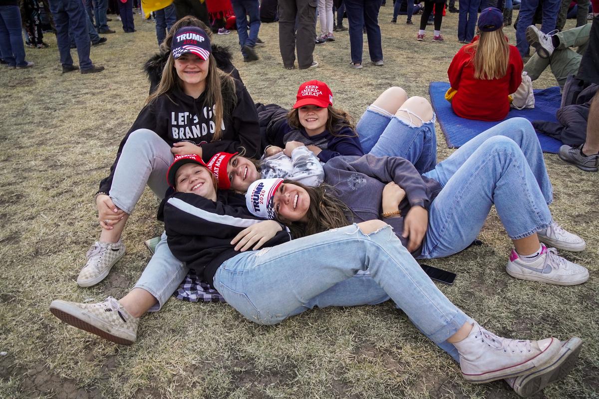 A group of teens show their support for President Donald Trump in 2024 during a rally in Florence, Ariz., on Jan. 15, 2022. (Allan Stein/The Epoch Times)