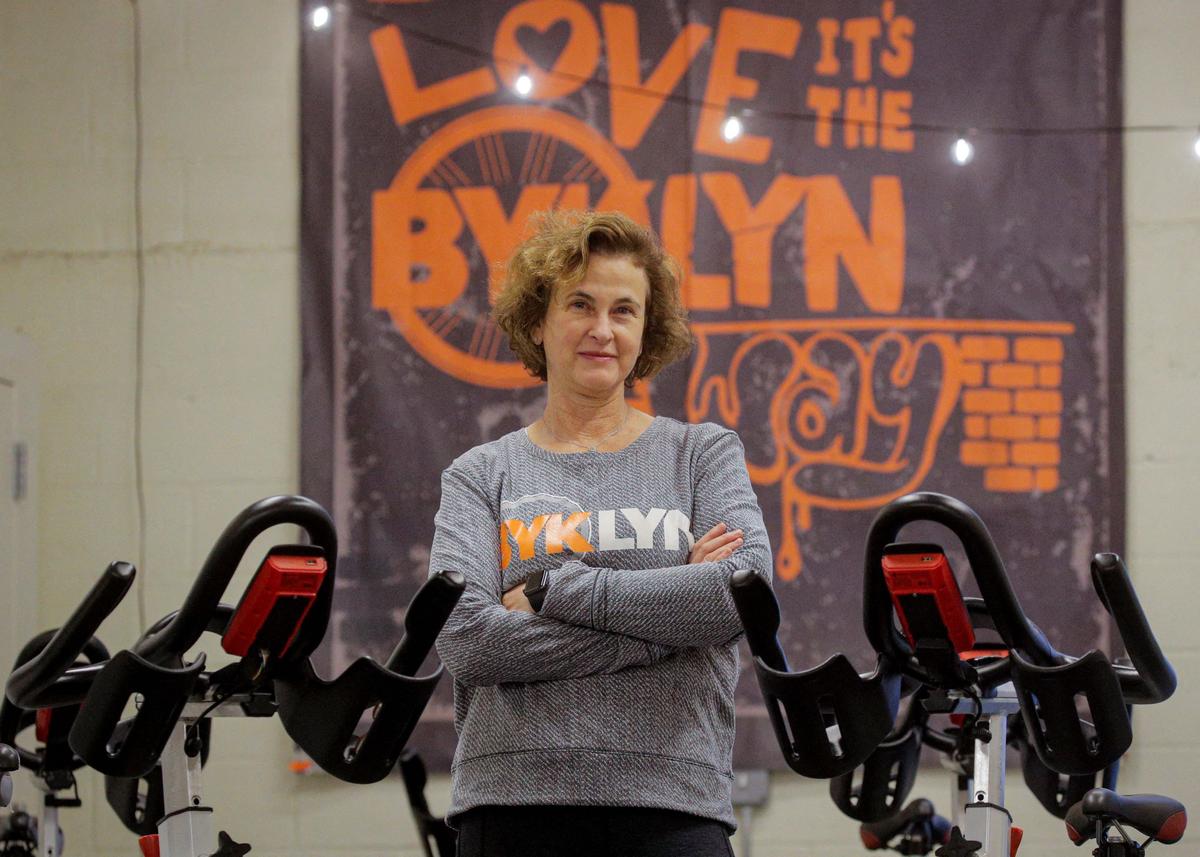 Amy Glosser poses in her cycling studio, BYKlyn, in Brooklyn, N.Y., on Jan. 14, 2022. (Brendan McDermid/Reuters)