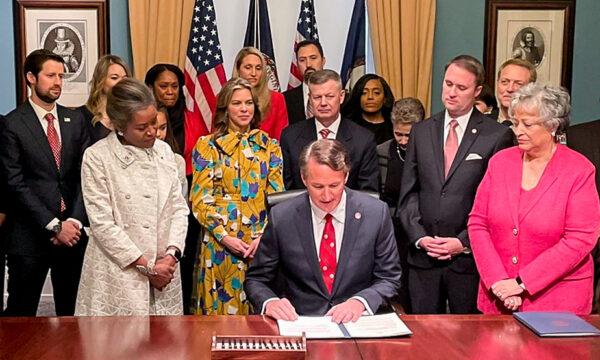 Virginia Governor Glenn Youngkin (C) signed an executive order in the State Capitol to ban the teaching of critical race theory in public education on Jan. 15, 2022. (Courtesy of Brandon Jarvis of Virginia Scope)