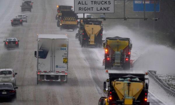 Vehicles navigate hazardous driving conditions along Interstate 85/40 as a winter storm moves through the area in Mebane, N.C., on Jan. 16, 2022. (Gerry Broome/AP Photo)