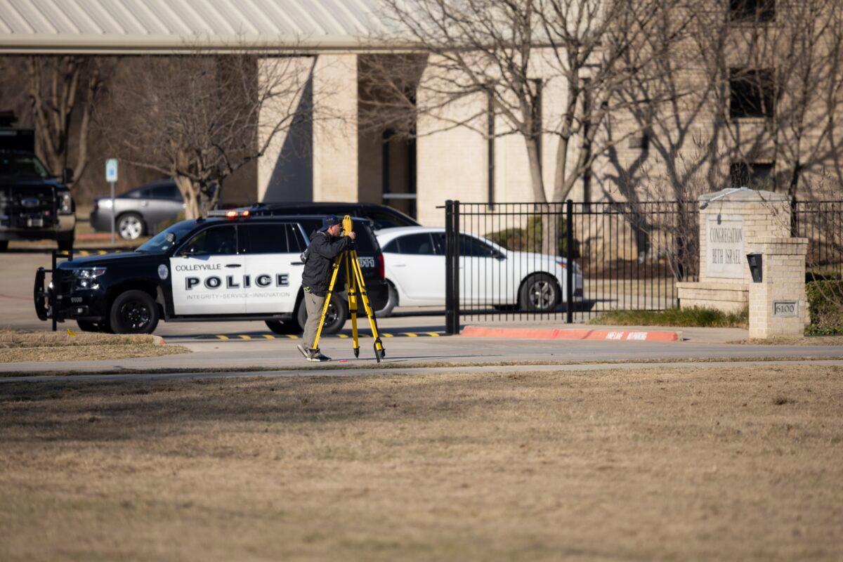 Law enforcement process the scene in front of the Congregation Beth Israel synagogue in Colleyville, Texas, on Jan. 16, 2022. (Brandon Wade/AP Photo)