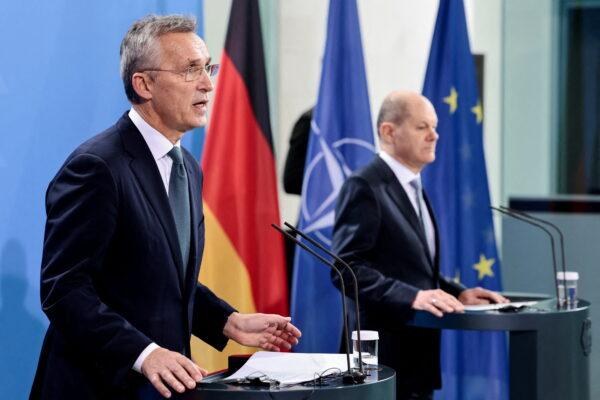 NATO Secretary-General Jens Stoltenberg (L) speaks during a news conference with German Chancellor Olaf Scholz in Berlin, on Jan. 18, 2022. (Hannibal Hanschke/Reuters)