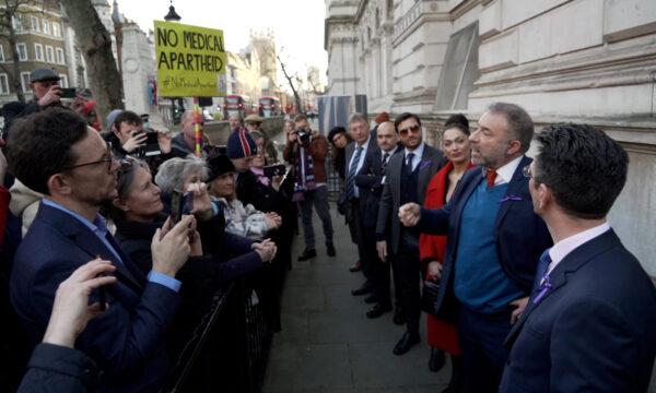 Screenshot from a video showing Alan Miller (2nd R), who launched the anti-restriction campaign Together, as he speaks outside No. 10 Downing Street in London, on Jan. 17, 2022. (Earl Rhodes/NTD)