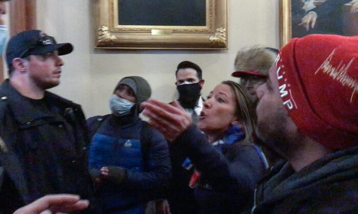 Extensive video evidence shows that Ashli Babbitt tried to stop rioters in the hallway outside the Speaker's Lobby. The "Anarchy Princess" accuses Ashli Babbitt of trying to kill police and lawmakers on Jan. 6, 2021. (Tayler Hansen/Screenshot via The Epoch Times)