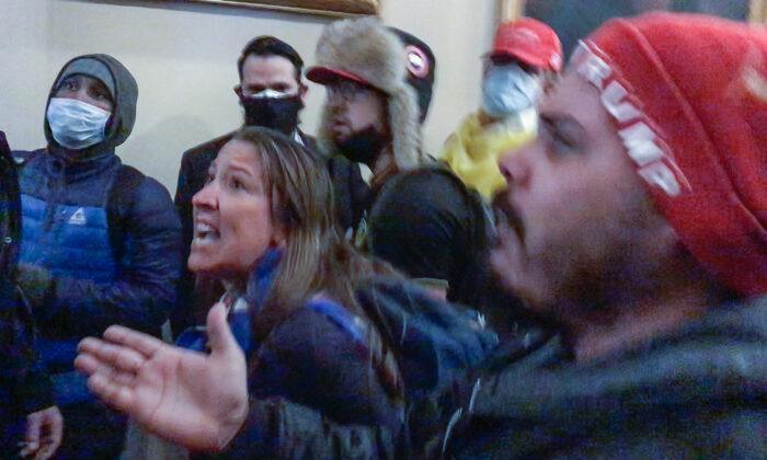 Ashli Babbitt pleads with police to call for backup at the Speaker's Lobby doors on Jan. 6, 2021. Overhead CCTV video footage now under court seal could answer many questions about her shooting death. (Video Still / ©Tayler Hansen)