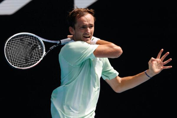 Daniil Medvedev of Russia plays a forehand return to Henri Laaksonen of Switzerland, during their first round match at the Australian Open tennis championships in Melbourne, on Jan. 18, 2022. (Hamish Blair/AP Photo)