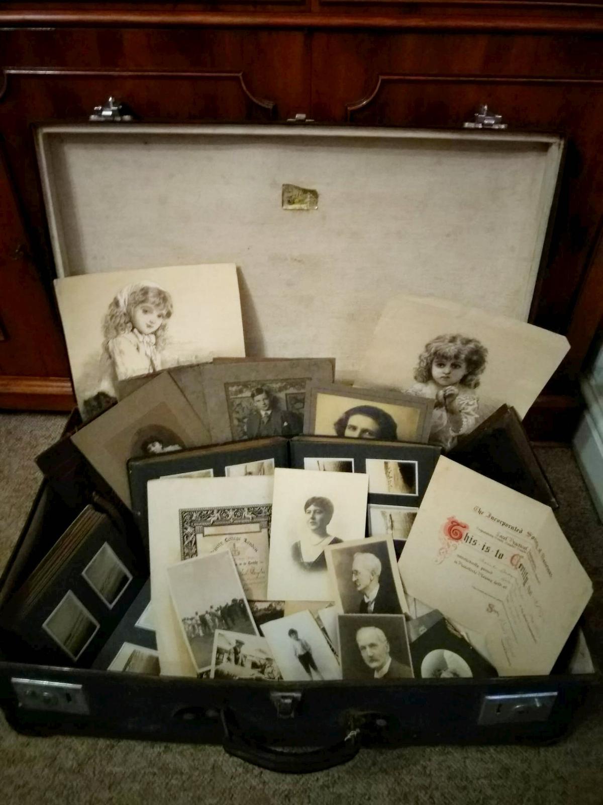Suitcase found in the garage filled with old photos, many relating to Johnny Douglas. (SWNS)