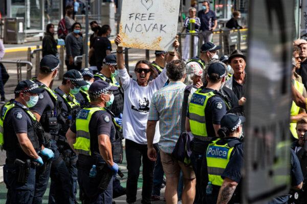 Serbian tennis fans and anti-COVID restriction protesters rally outside the Park Hotel in Melbourne, Australia, on Jan. 8, 2022. (Diego Fedele/Getty Images)