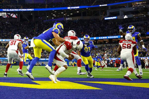 Kyler Murray #1 of the Arizona Cardinals is tackled by Leonard Floyd #54 of the Los Angeles Rams in the second quarter of the NFC Wild Card Playoff game at SoFi Stadium in Inglewood, Calif., on Jan. 17, 2022. (Ronald Martinez/Getty Images)