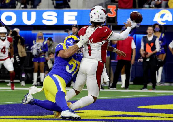 Kyler Murray #1 of the Arizona Cardinals is tackled by Anthony Hines III #57 of the Los Angeles Rams in the second quarter of the NFC Wild Card Playoff game at SoFi Stadium, Calif., on Jan. 17, 2022. (Harry How/Getty Images)