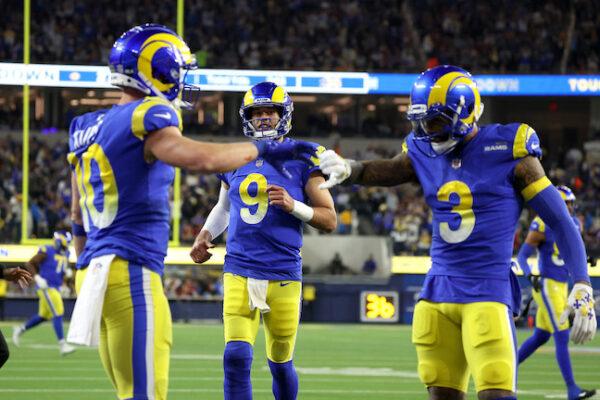 Matthew Stafford #9 of the Los Angeles Rams celebrates his touchdown pass to Cooper Kupp #10 of the Los Angeles Rams during the third quarter against the Arizona Cardinals in the NFC Wild Card Playoff game at SoFi Stadium in Inglewood, Calif., on Jan. 17, 2022. (Harry How/Getty Images)