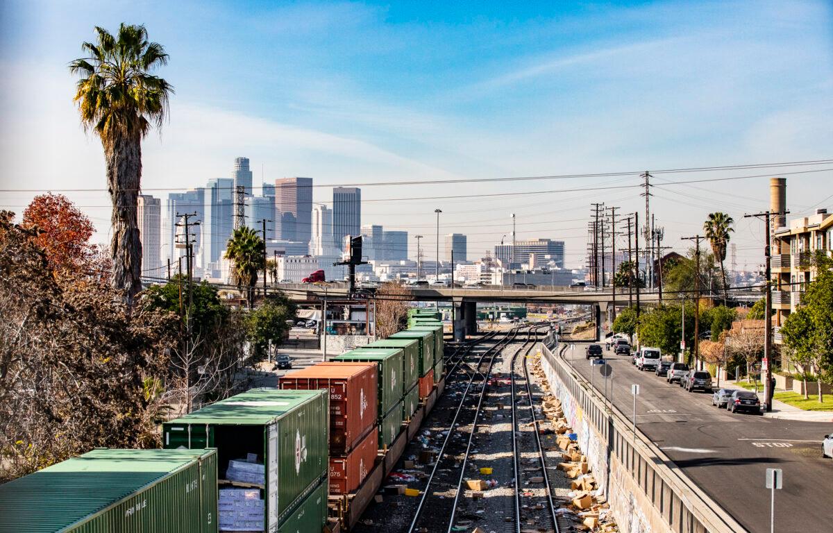 Torn open boxes line train tracks outside of downtown Los Angeles after recurring railway robberies, on Jan. 14, 2022. (John Fredricks/The Epoch Times)