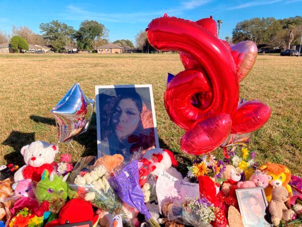 A makeshift memorial sits near the side of a street next to a large grassy area where Diamond Alvarez was fatally shot, in Houston, on Jan 13, 2022. (Juan Lozano/AP Photo)