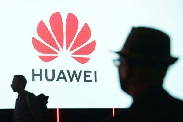 People arrive to attend the Huawei keynote address at the IFA 2020 Special Edition consumer electronics and appliances trade fair on the fair's opening day in Berlin on Sept. 3, 2020. (Sean Gallup/Getty Images)