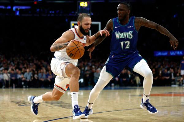 Evan Fournier #13 of the New York Knicks dribbles against Taurean Prince #12 of the Minnesota Timberwolves during the second half at Madison Square Garden, in New York City, on Jan. 18, 2022. (Sarah Stier/Getty Images)