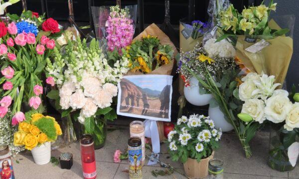 Flowers placed outside Croft House furniture store in memory of graduate student Brianna Kupfer, in Los Angeles on Jan. 18, 2022. (Alice Sun/The Epoch Times)