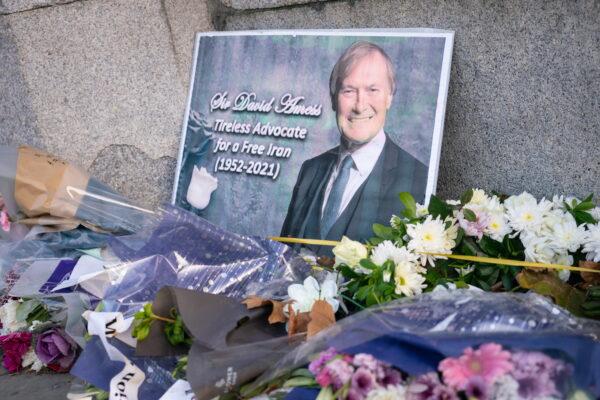 Flowers were left in memory of Sir David Amess outside the Houses of Parliament, in Westminster, London, on Oct. 22, 2021. (Dominic Lipinski/PA)