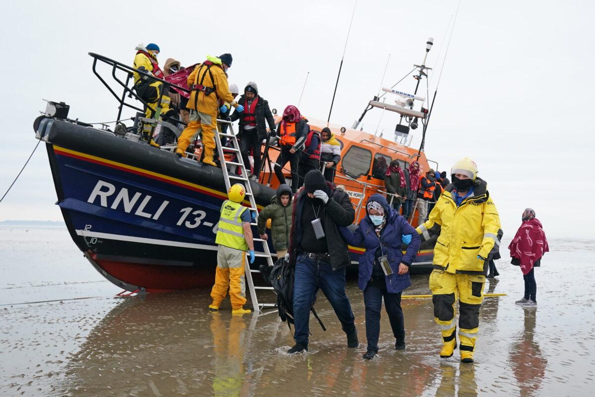 Undated file photo showing a group of people thought to be illegal immigrants brought in to Dungeness, Kent, by the Royal National Lifeboat Institution. (Gareth Fuller/PA)