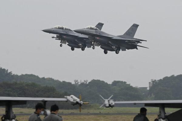 Two armed U.S.-made F-16V fighters fly over at an air force base in Chiayi, southern Taiwan on Jan. 5, 2022. (Sam Yeh/AFP via Getty Images)