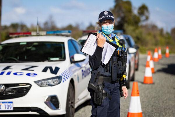 WA Police inspect cars at a Border Check Point on Indian Ocean Drive north of Perth, Australia, on Jun. 29, 2021. (Matt Jelonek/Getty Images)