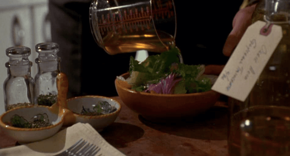 The actual Lorenzo's oil being poured on a salad, in a scene from "Lorenzo's Oil." (Universal Pictures)