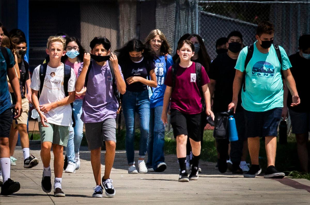  Students walk outside Hewes Middle School in Tustin, Calif., on Aug. 12, 2021. (John Fredricks/The Epoch Times)