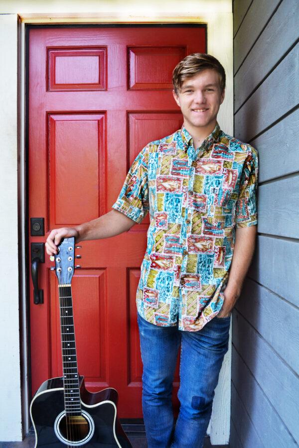 Zach, 17, in this 2017 photo was awarded the first guitar given by Musical Mentors. He became a volunteer mentor for two years. (Courtesy of Duff Rowden)